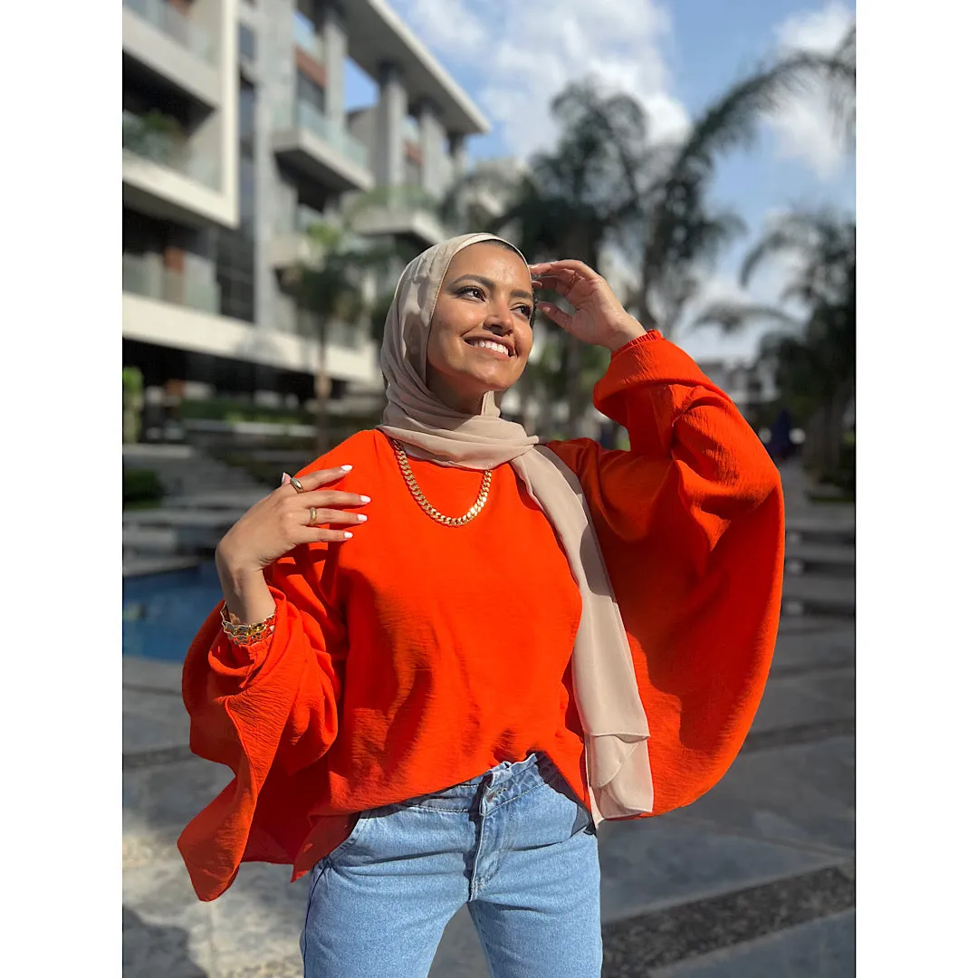 Orange double breasted ruffled blouse